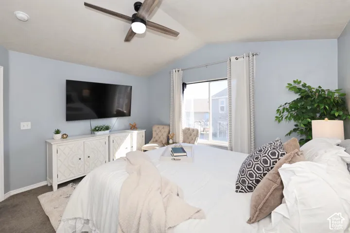 Bedroom featuring carpet and ceiling fan