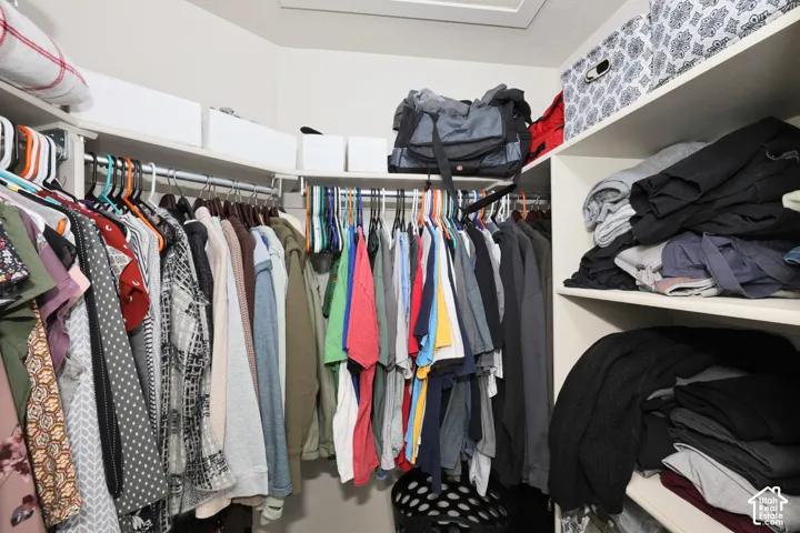 Walk in closet featuring attic access