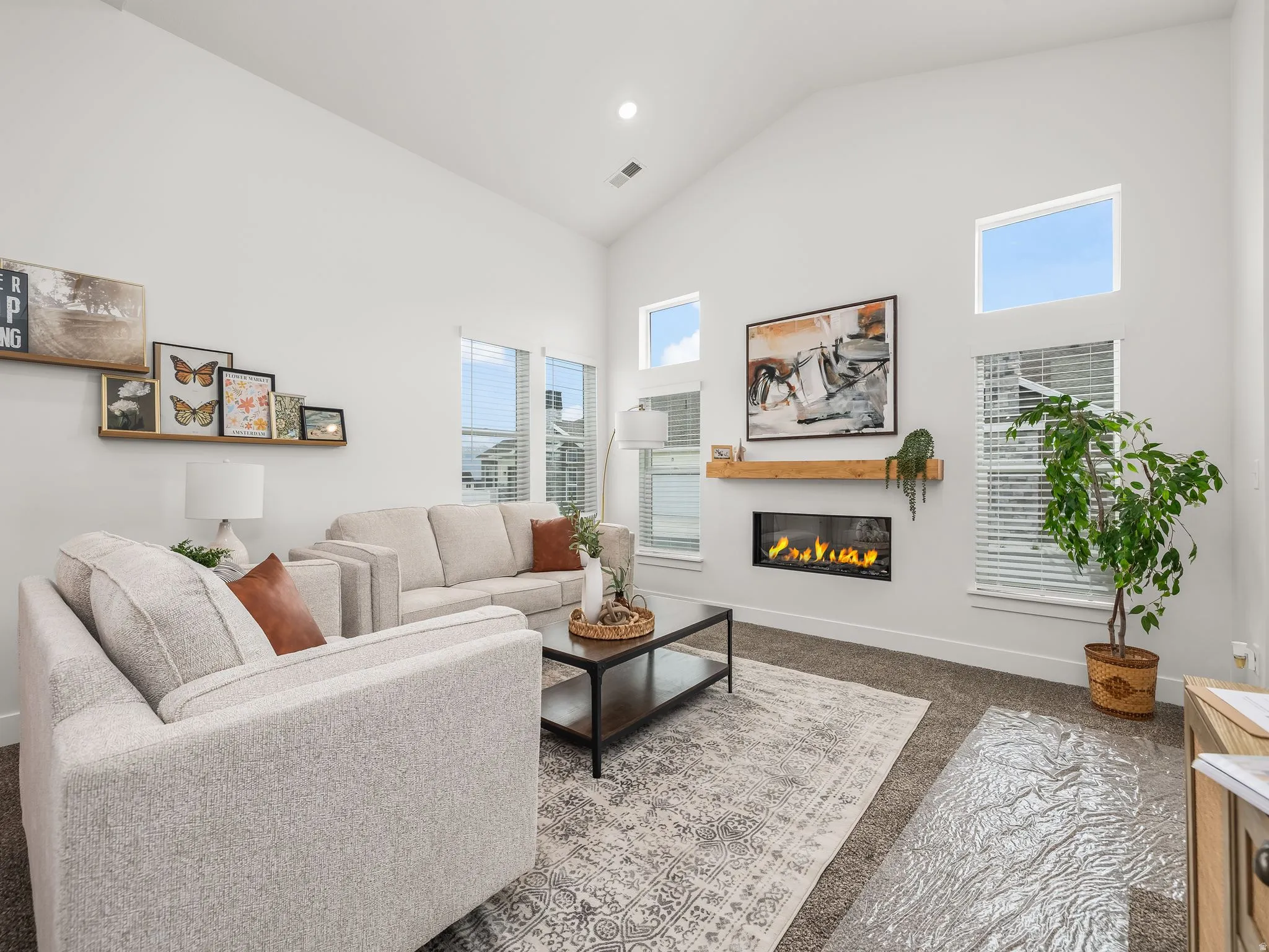Great room with vaulted ceilings and cozy fireplace.