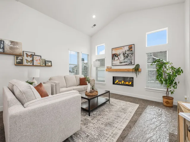 Great room with vaulted ceilings and cozy fireplace.