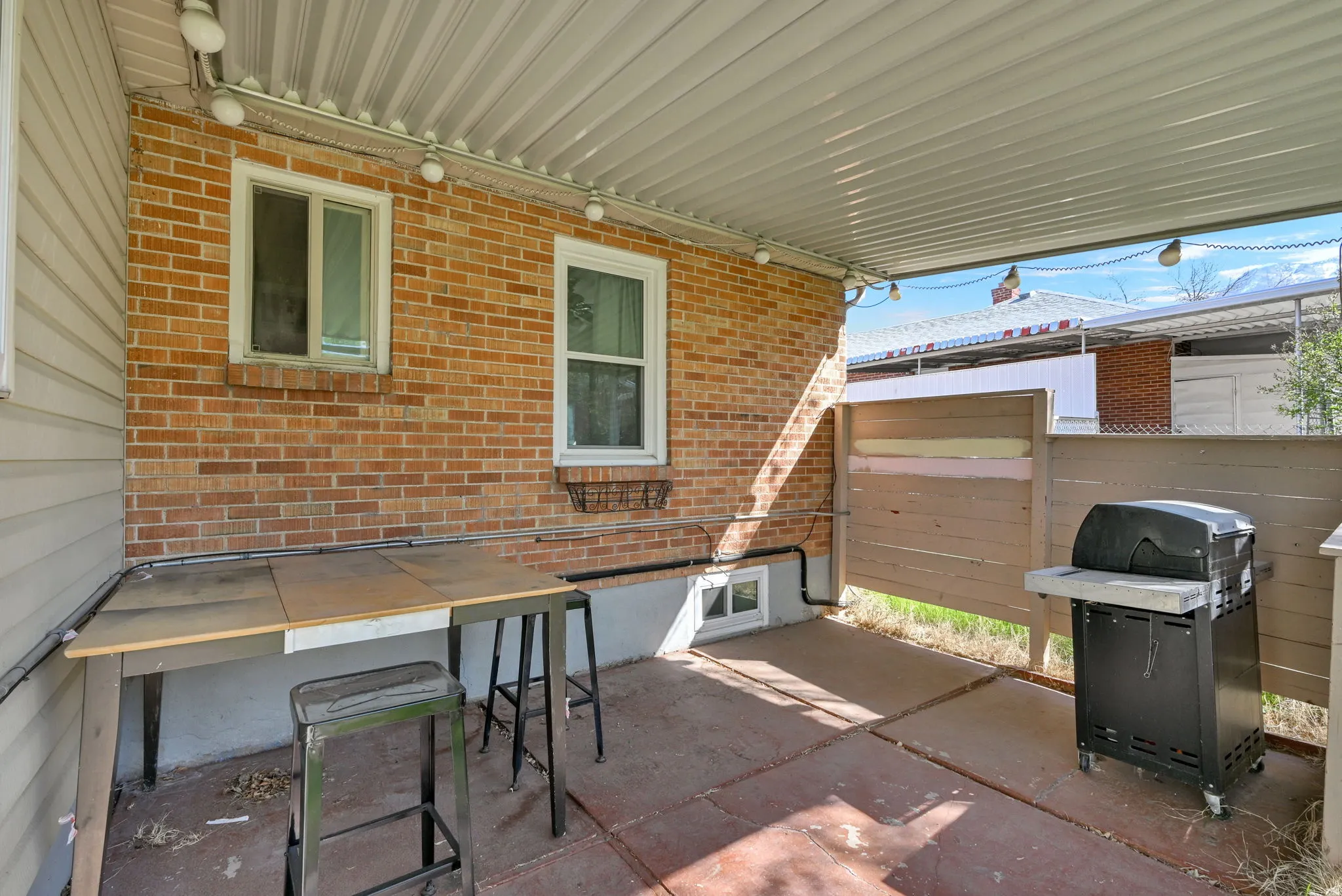 View of patio featuring a grill