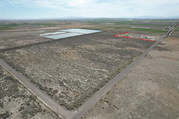 Aerial view of sparsely populated area with a nearby body of water