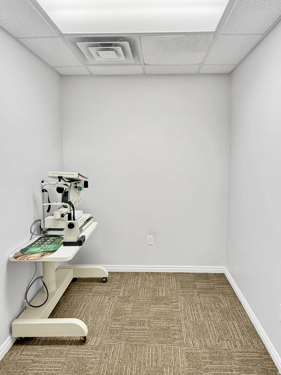 Misc room with carpet flooring and a paneled ceiling