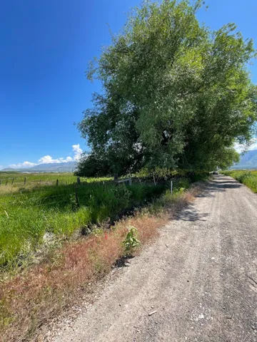 View of dirt / gravel road featuring a view of countryside