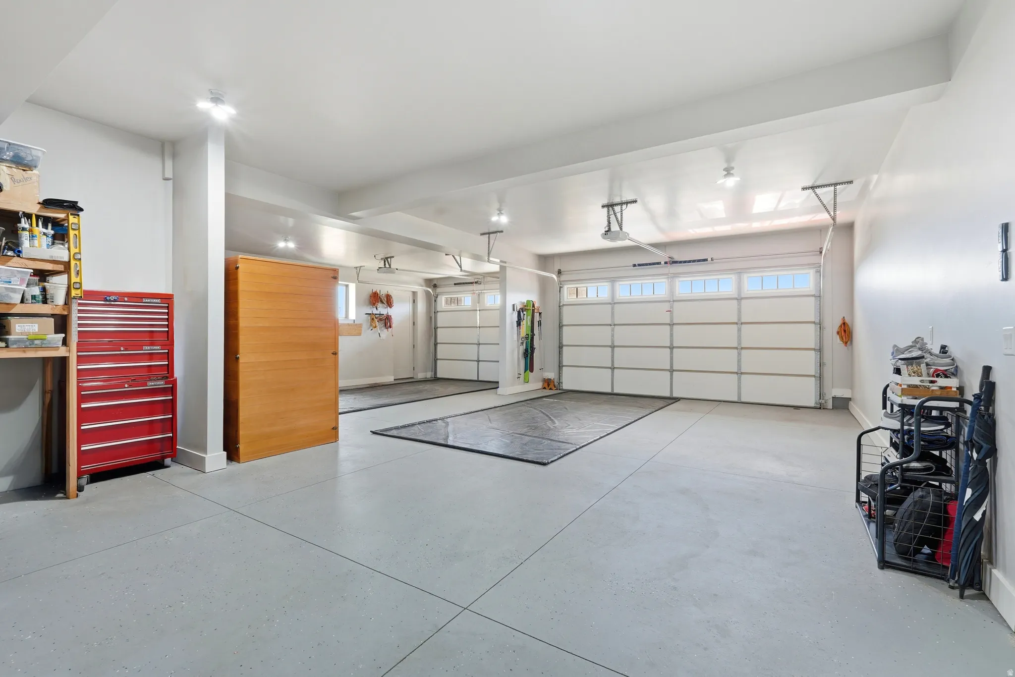 Garage featuring baseboards