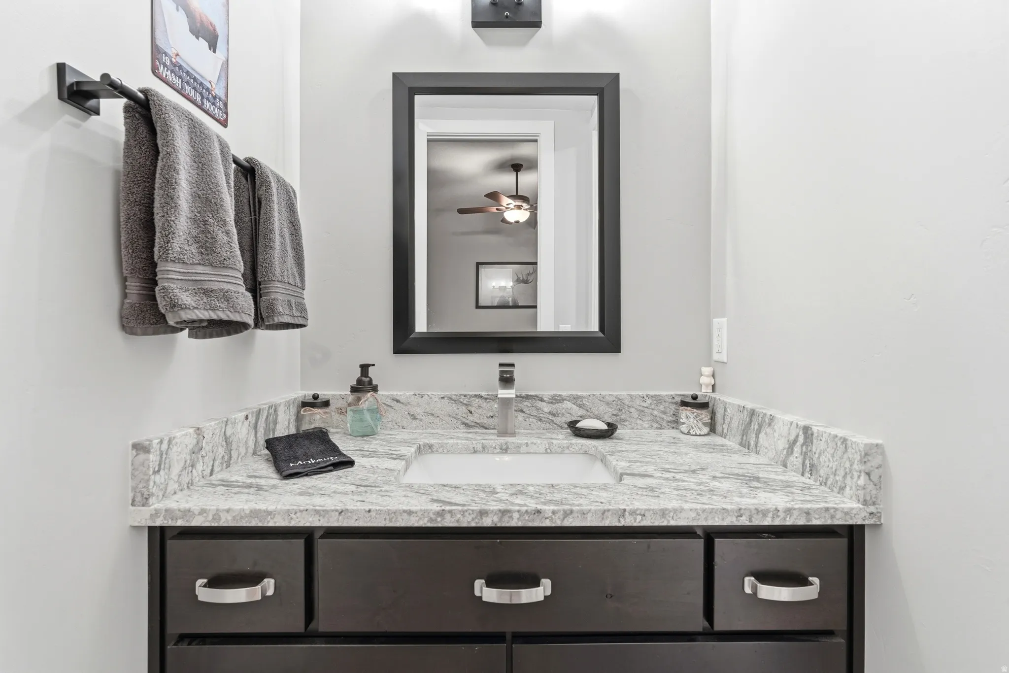 Bathroom with vanity and ceiling fan
