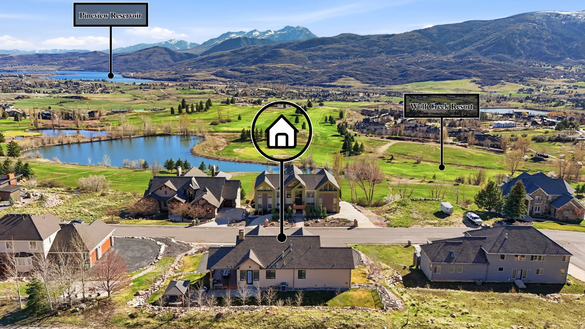 Aerial perspective of suburban area with a water and mountain view