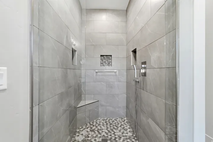 Full bath with a tile shower