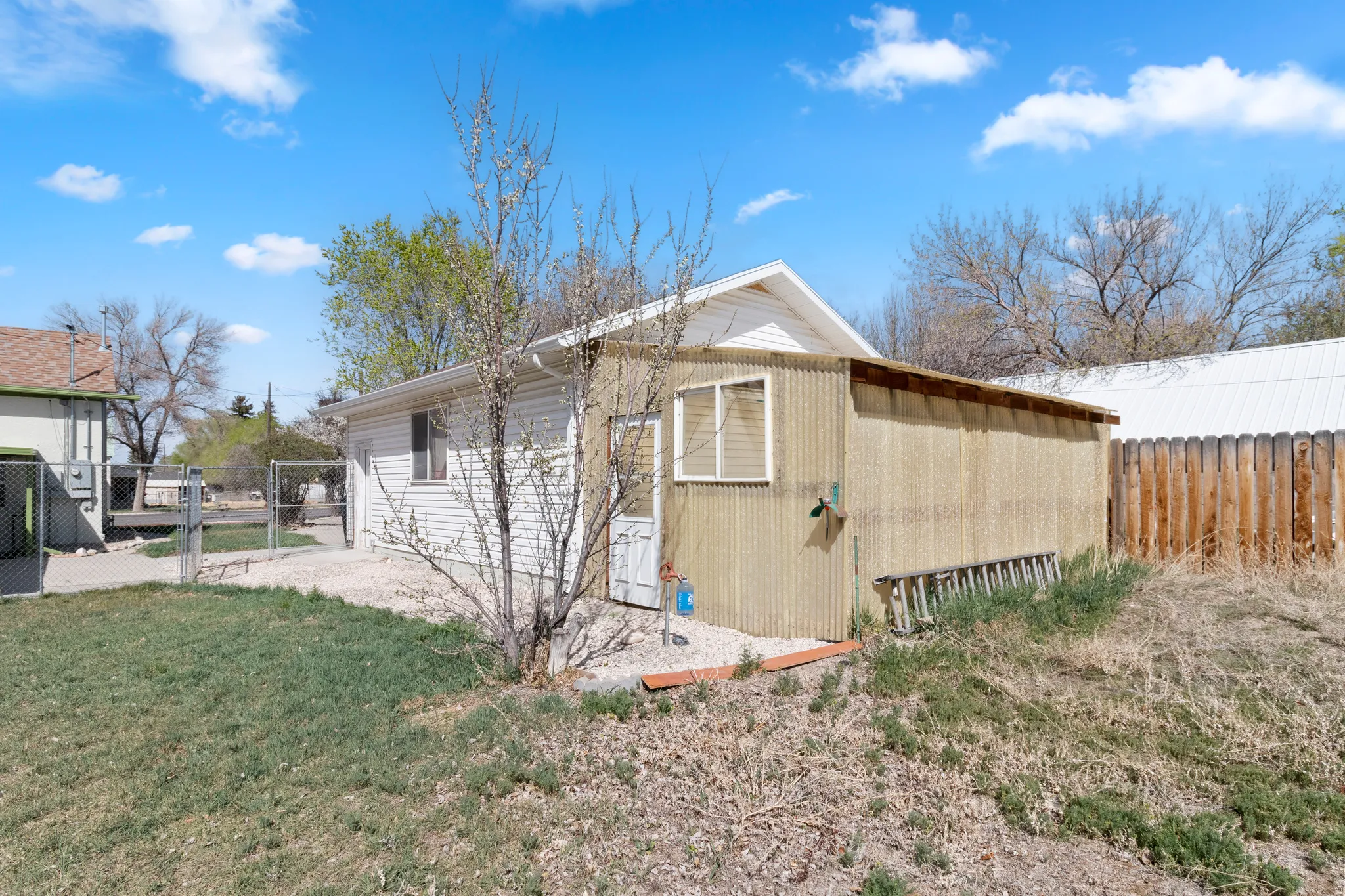 View of outbuilding with a gate