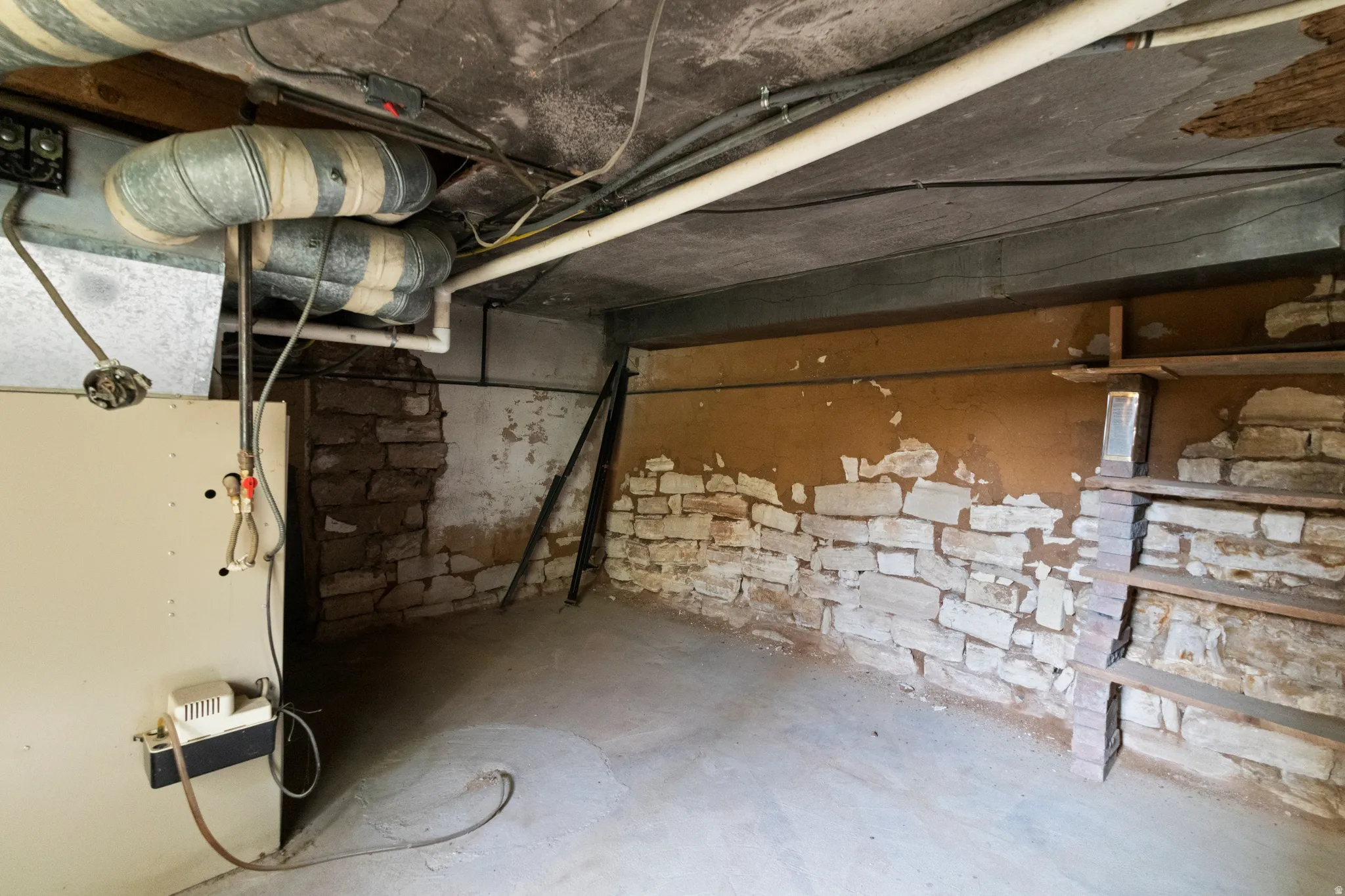 Unfinished basement with heating unit