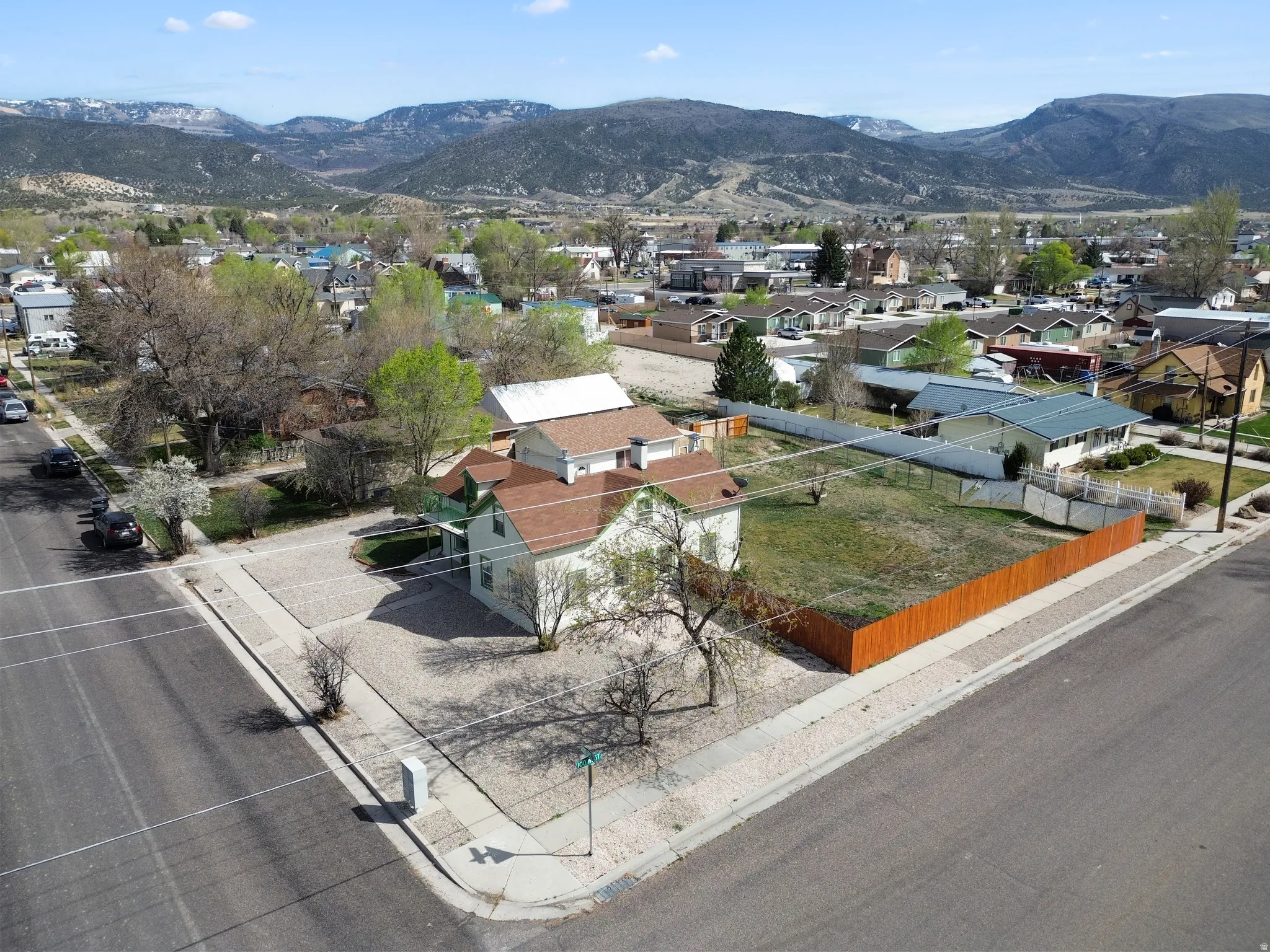 Aerial view of residential area featuring a mountainous background
