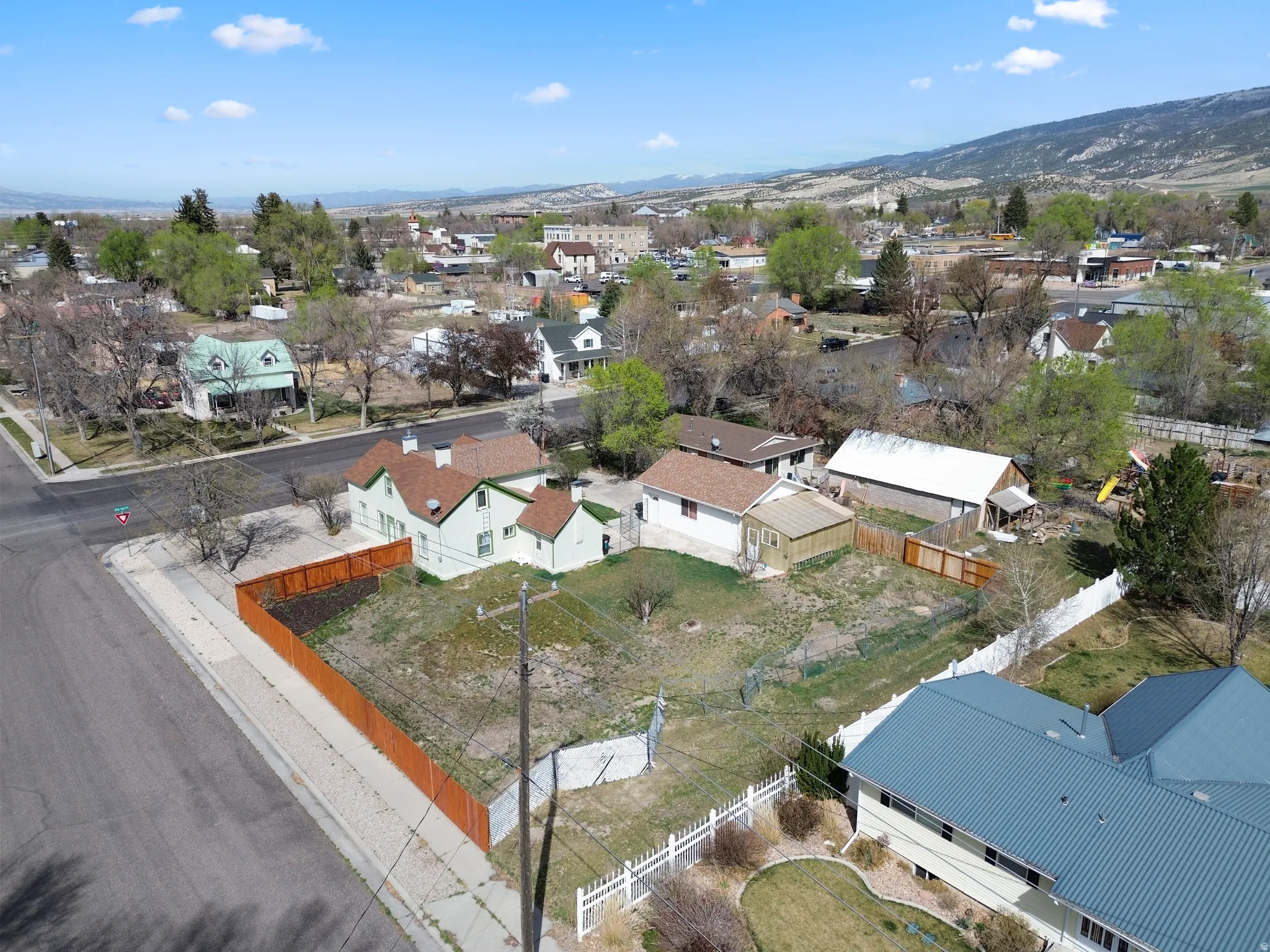 Aerial perspective of suburban area featuring a mountainous background