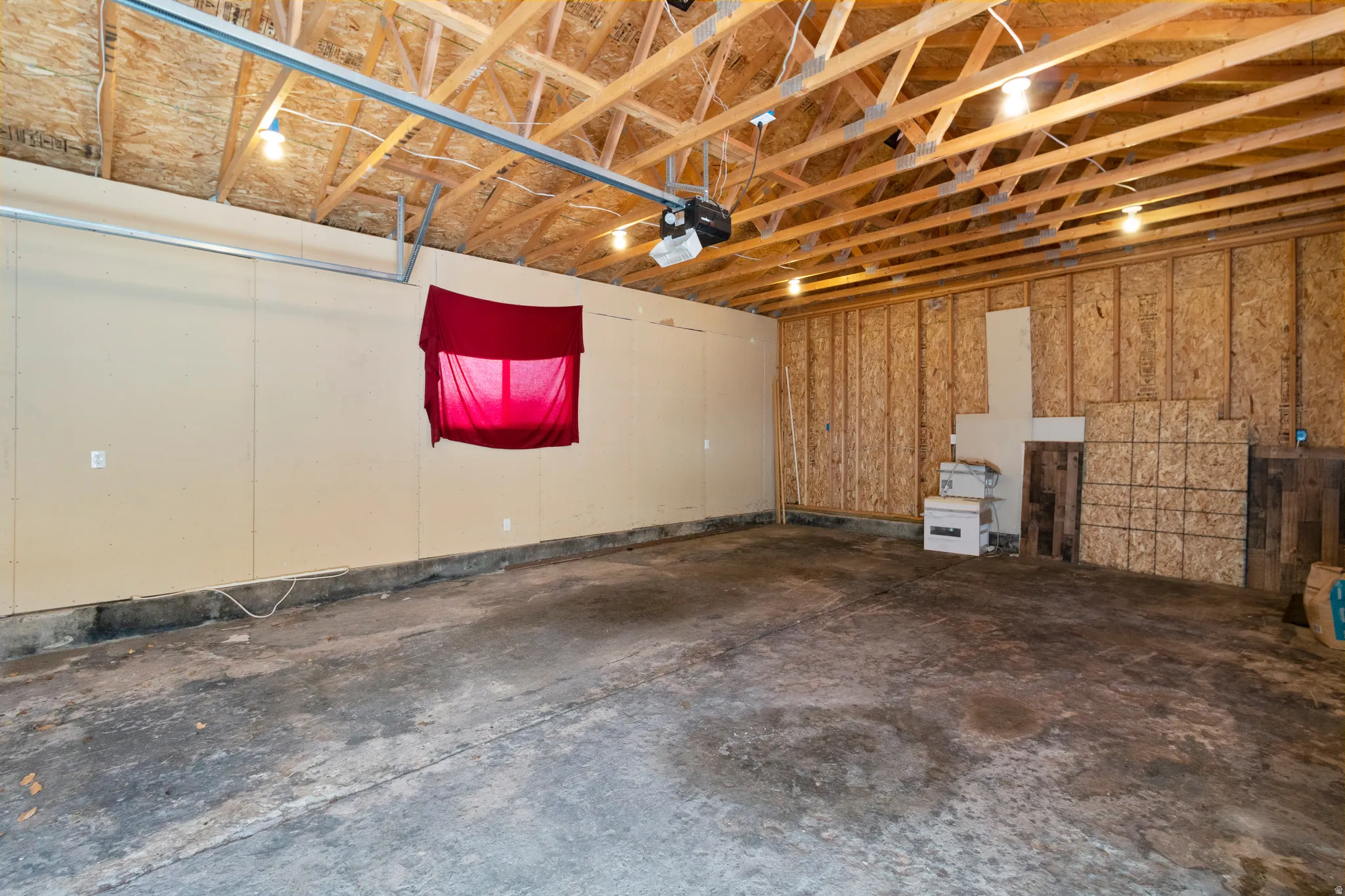 Garage featuring a garage door opener