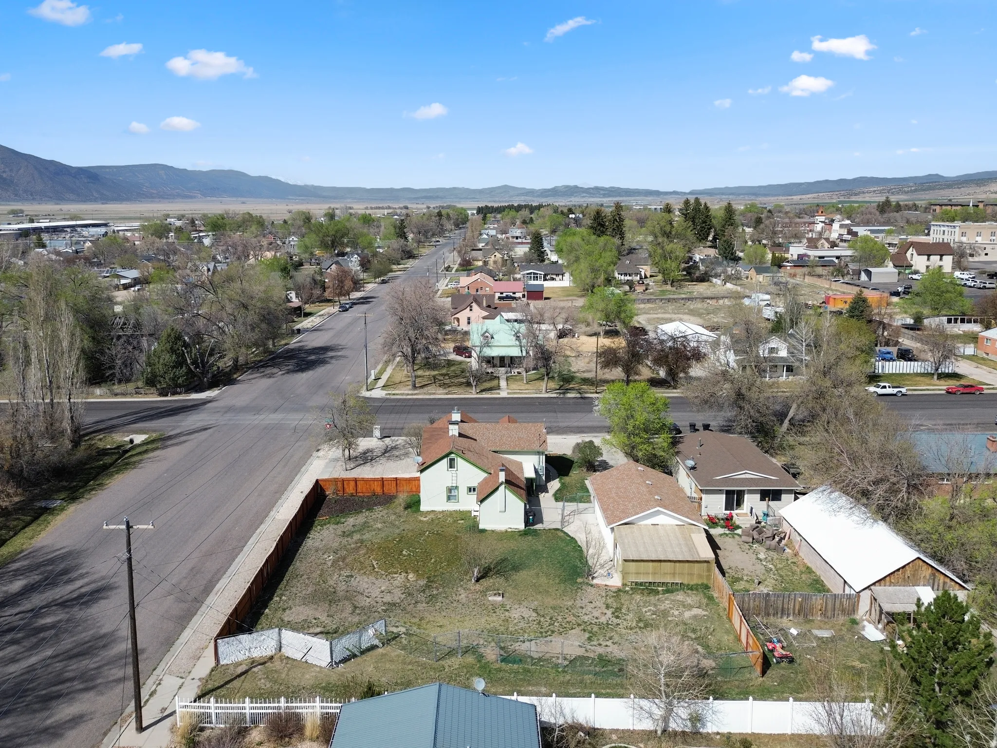 Aerial perspective of suburban area with a mountainous background