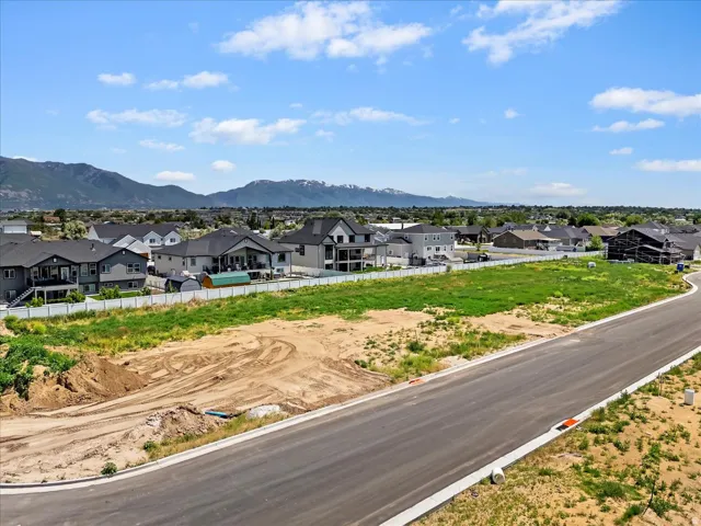 Aerial view of residential area featuring a mountain backdrop