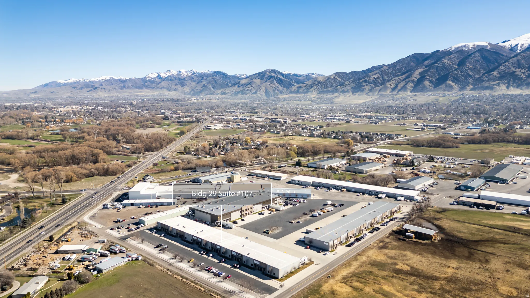 View of property location with an industrial area and mountains