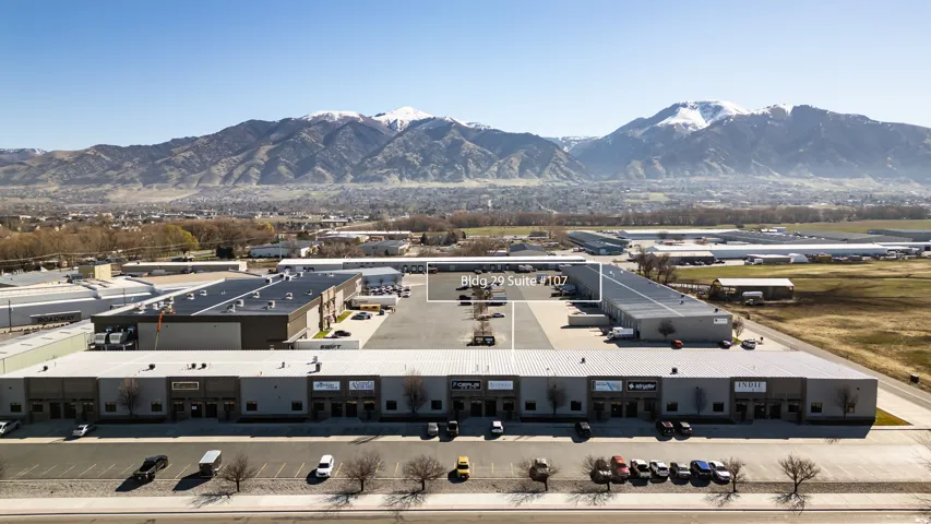 Bird's eye view of mountains and a commercial area