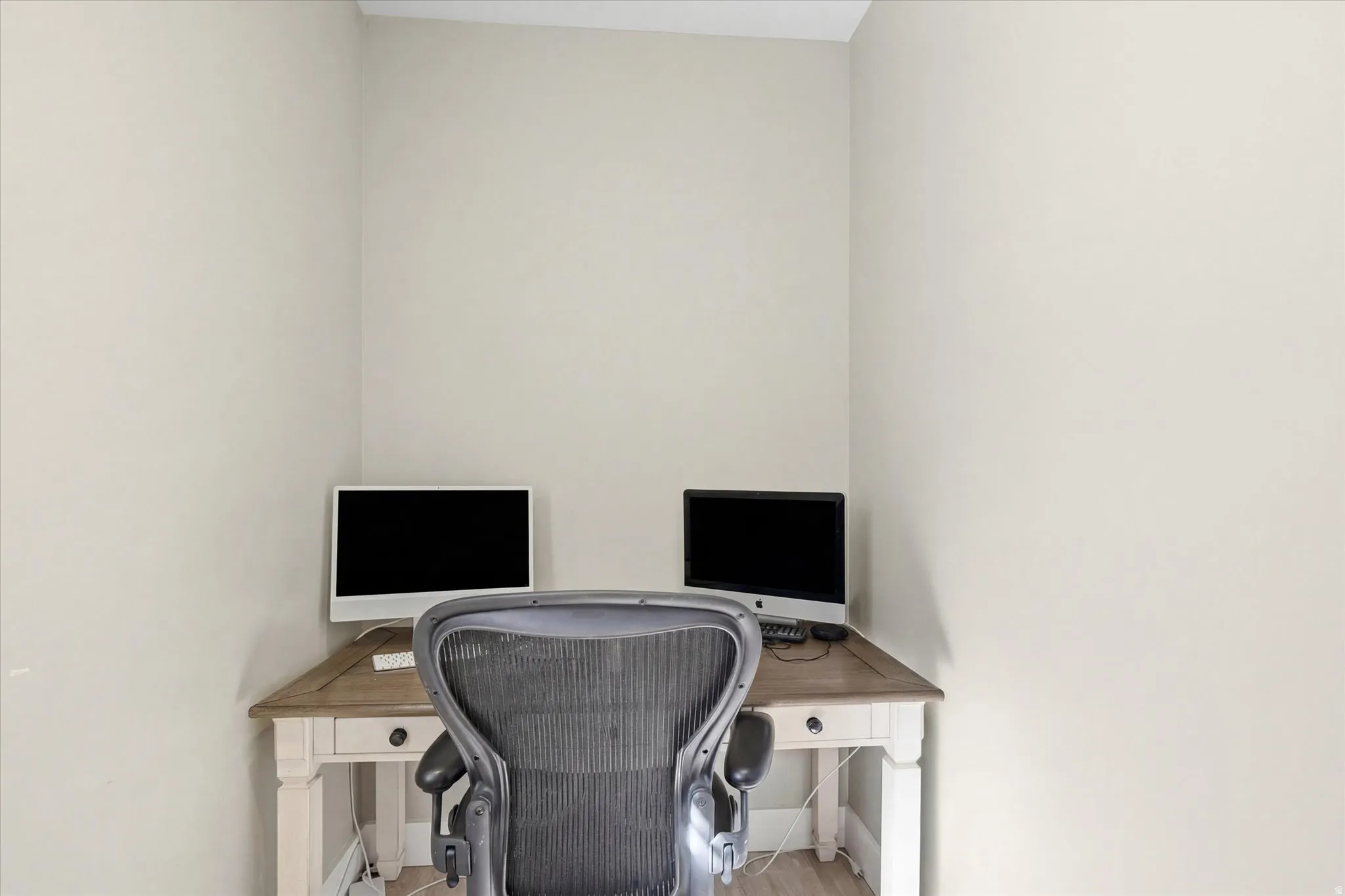 Office area with light wood-style floors