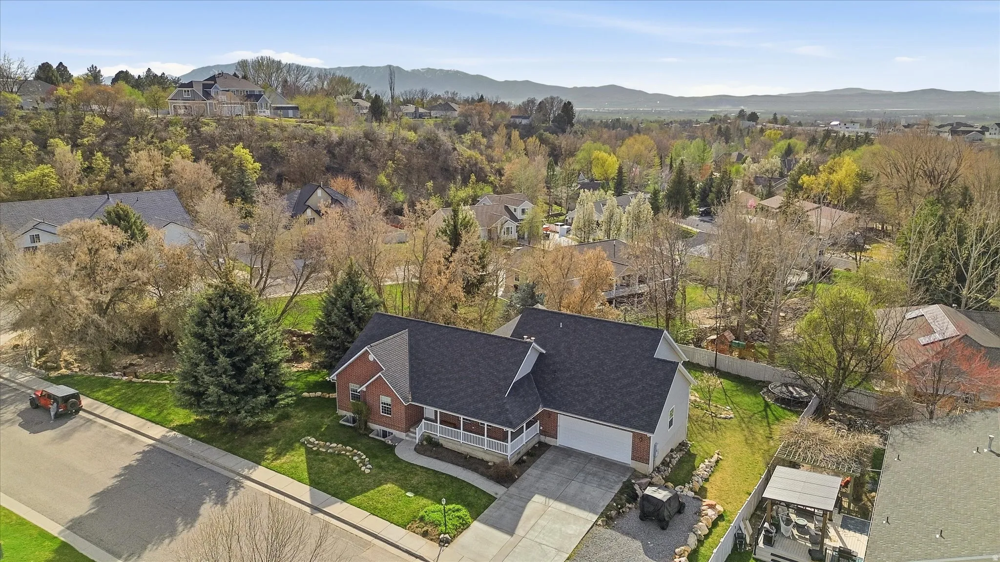 Aerial perspective of suburban area with a mountain backdrop