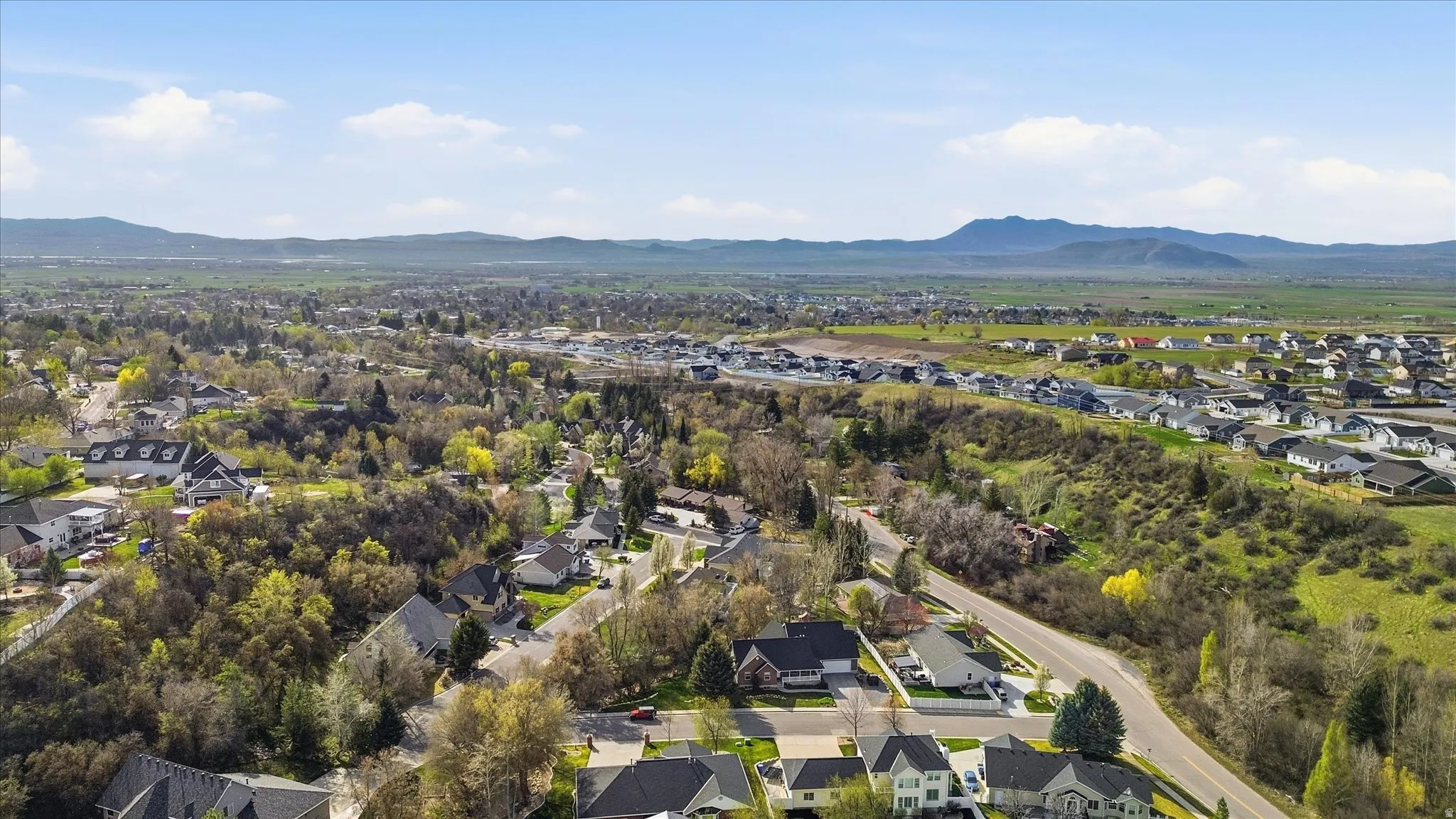 Aerial view of residential area featuring mountains