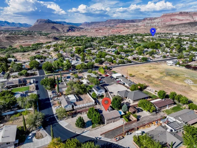 View of property location with a mountainous background and nearby suburban area