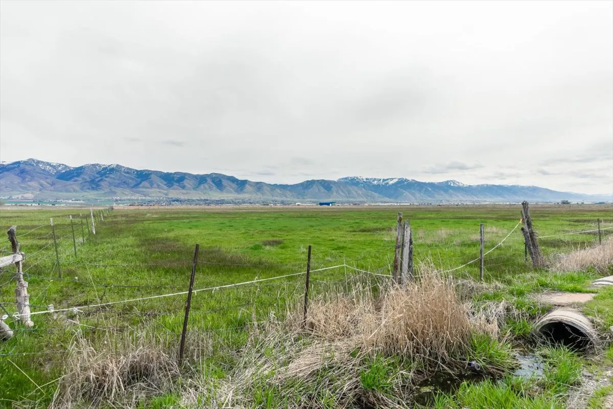 View of mountain backdrop with rural landscape