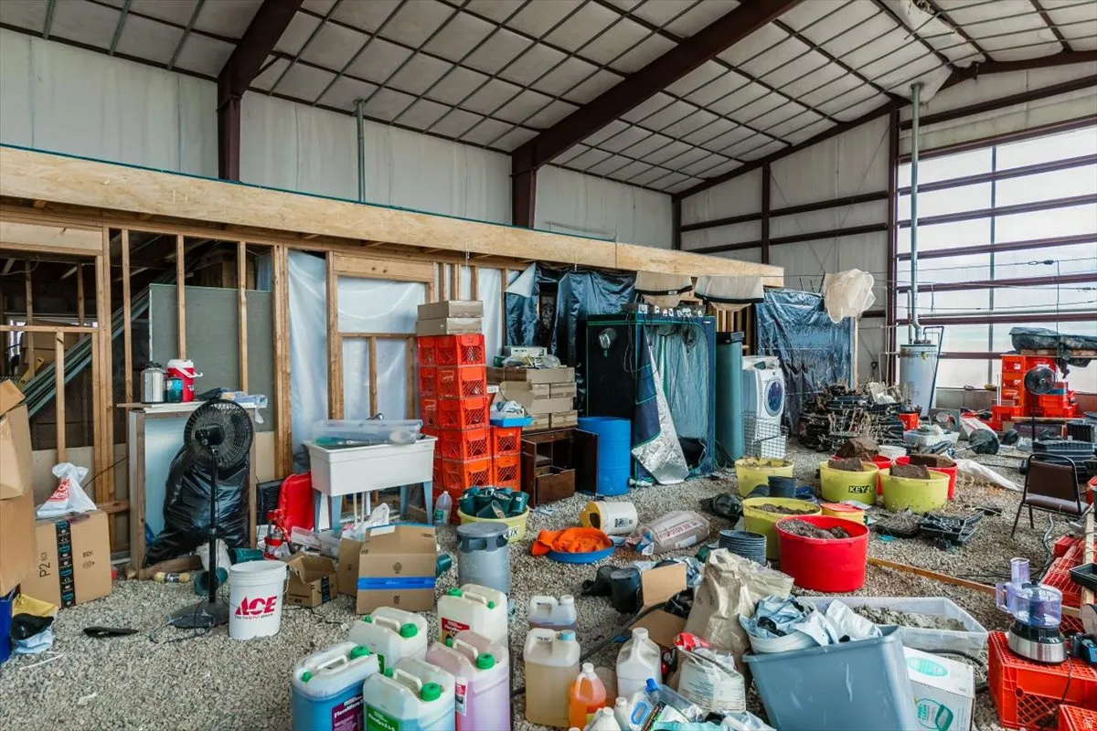 Garage with metal wall and a sink