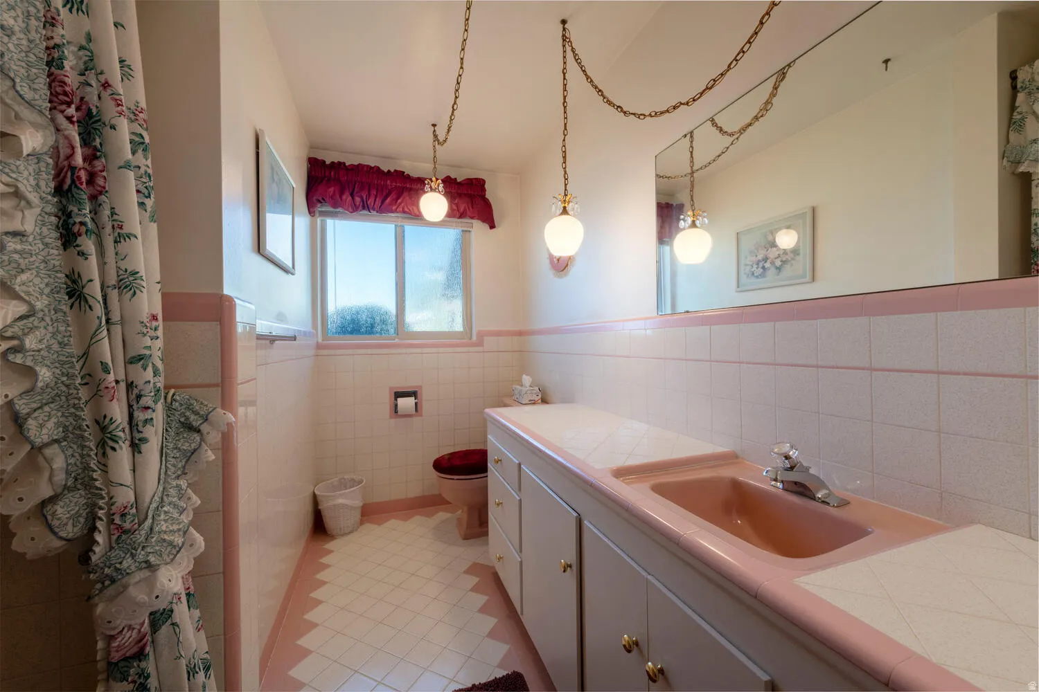 Bathroom featuring vanity, tile walls, a wainscoted wall, and a shower with shower curtain