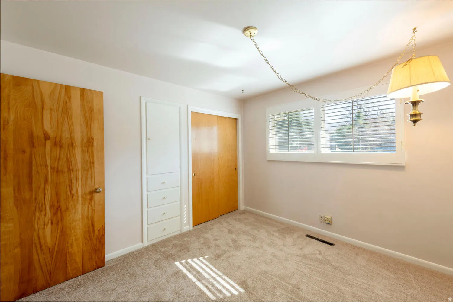 Unfurnished bedroom with a closet and carpet floors