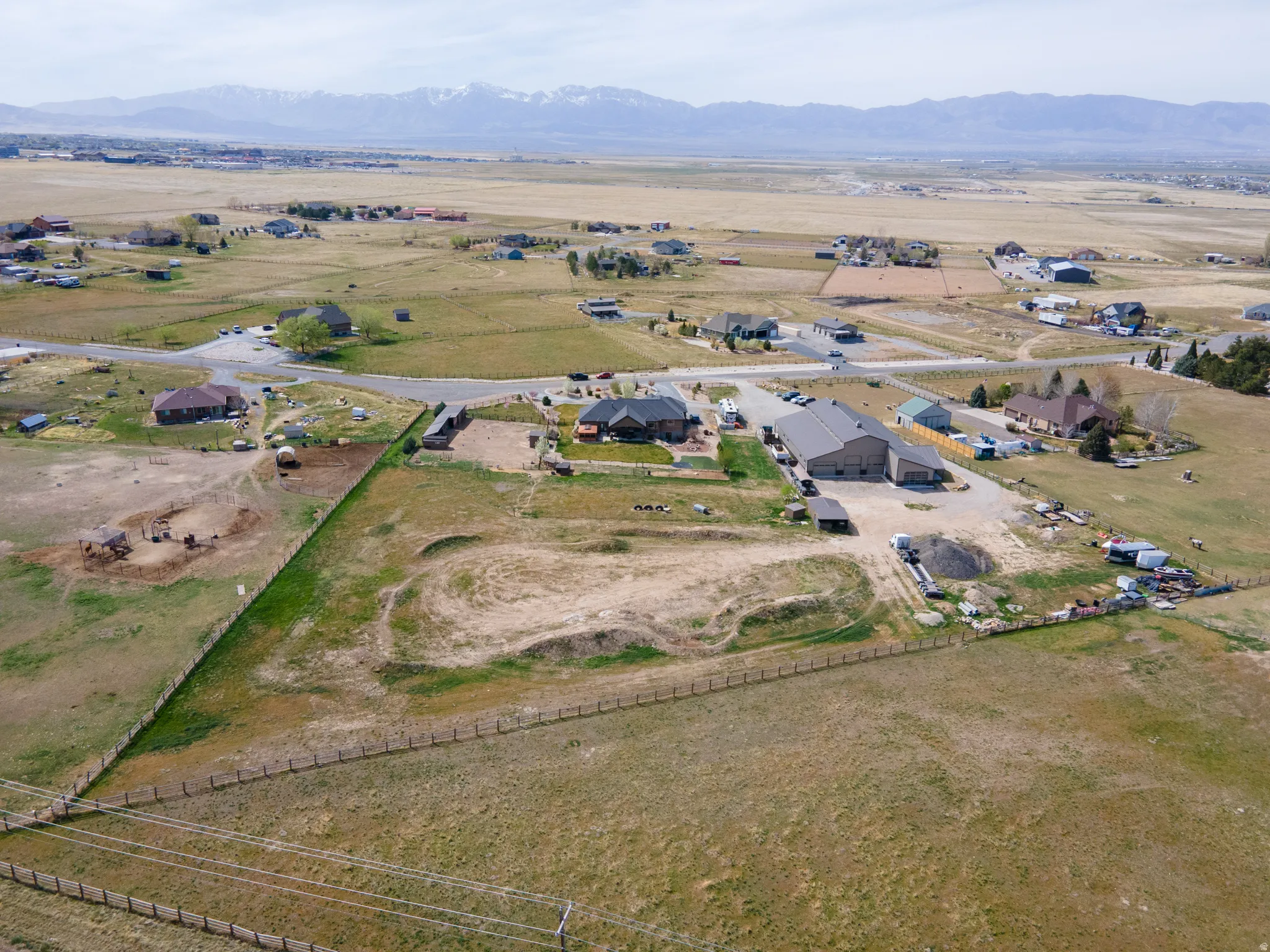 View of property location featuring rural landscape, a mountainous background, and nearby suburban area