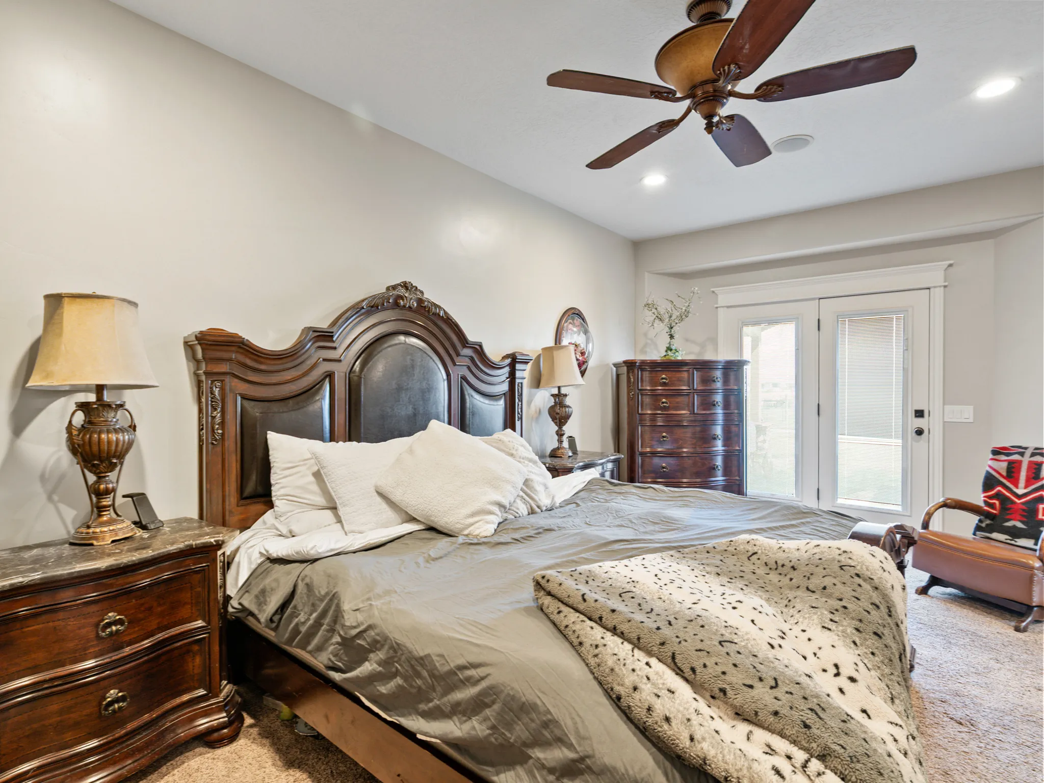Bedroom featuring light carpet, a ceiling fan, access to outside, and recessed lighting