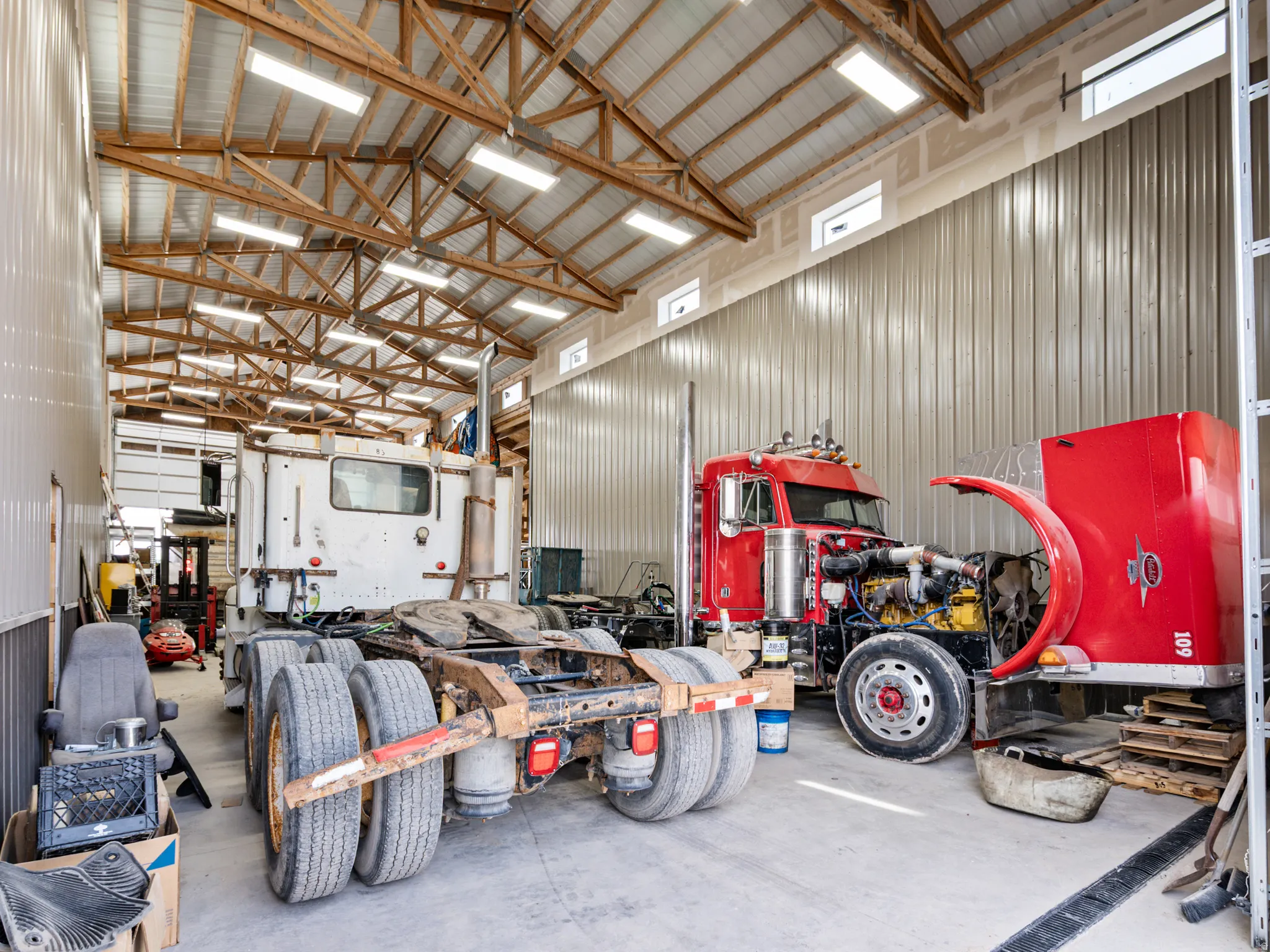Garage with metal wall and a workshop area