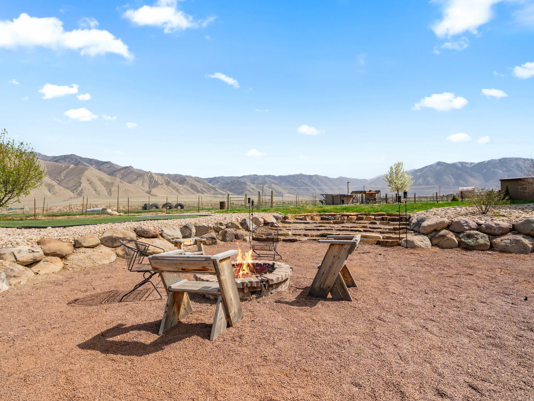 View of yard with a fire pit and a mountain view