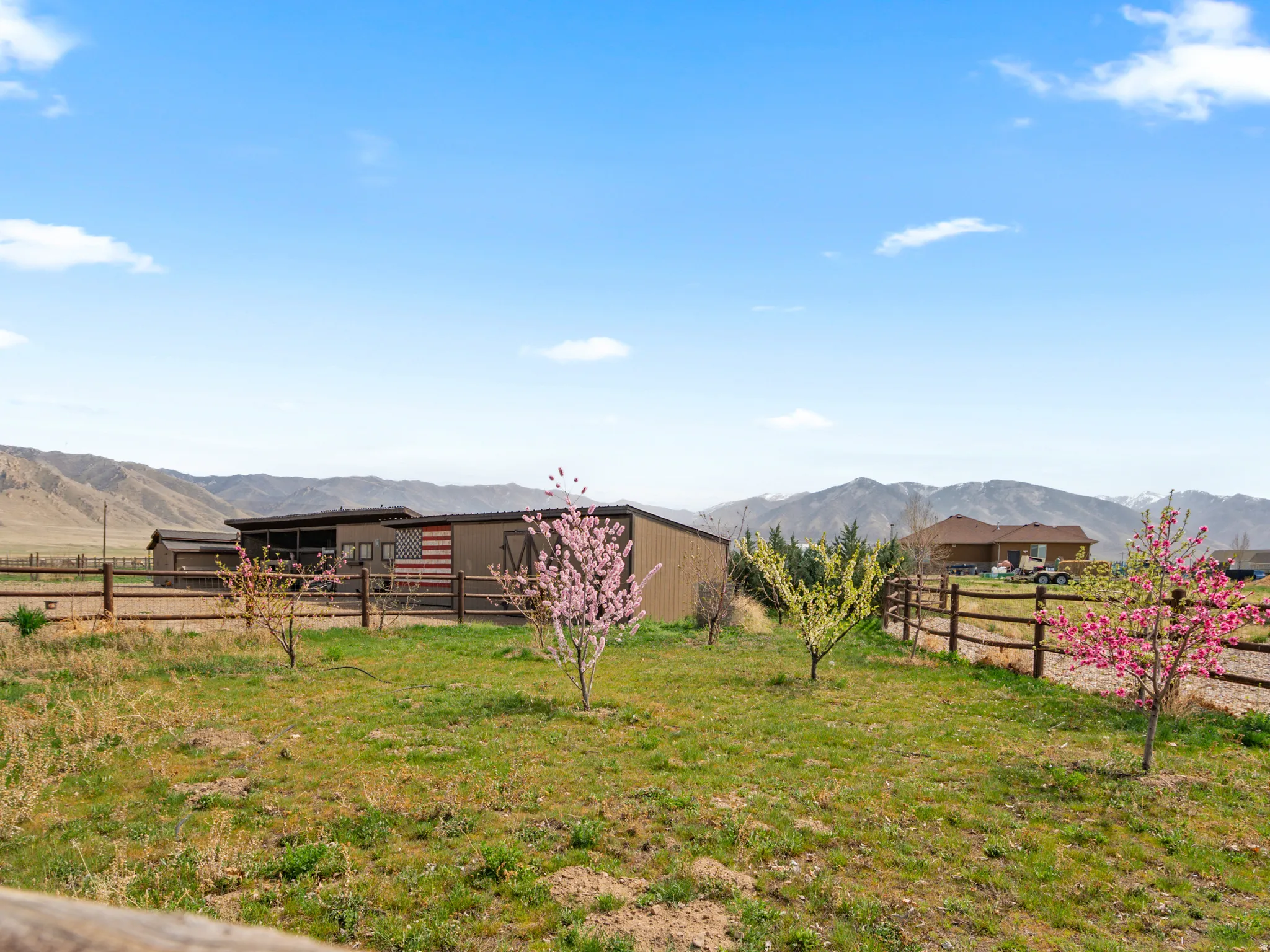 View of yard with a mountain view, an outbuilding, and a view of countryside