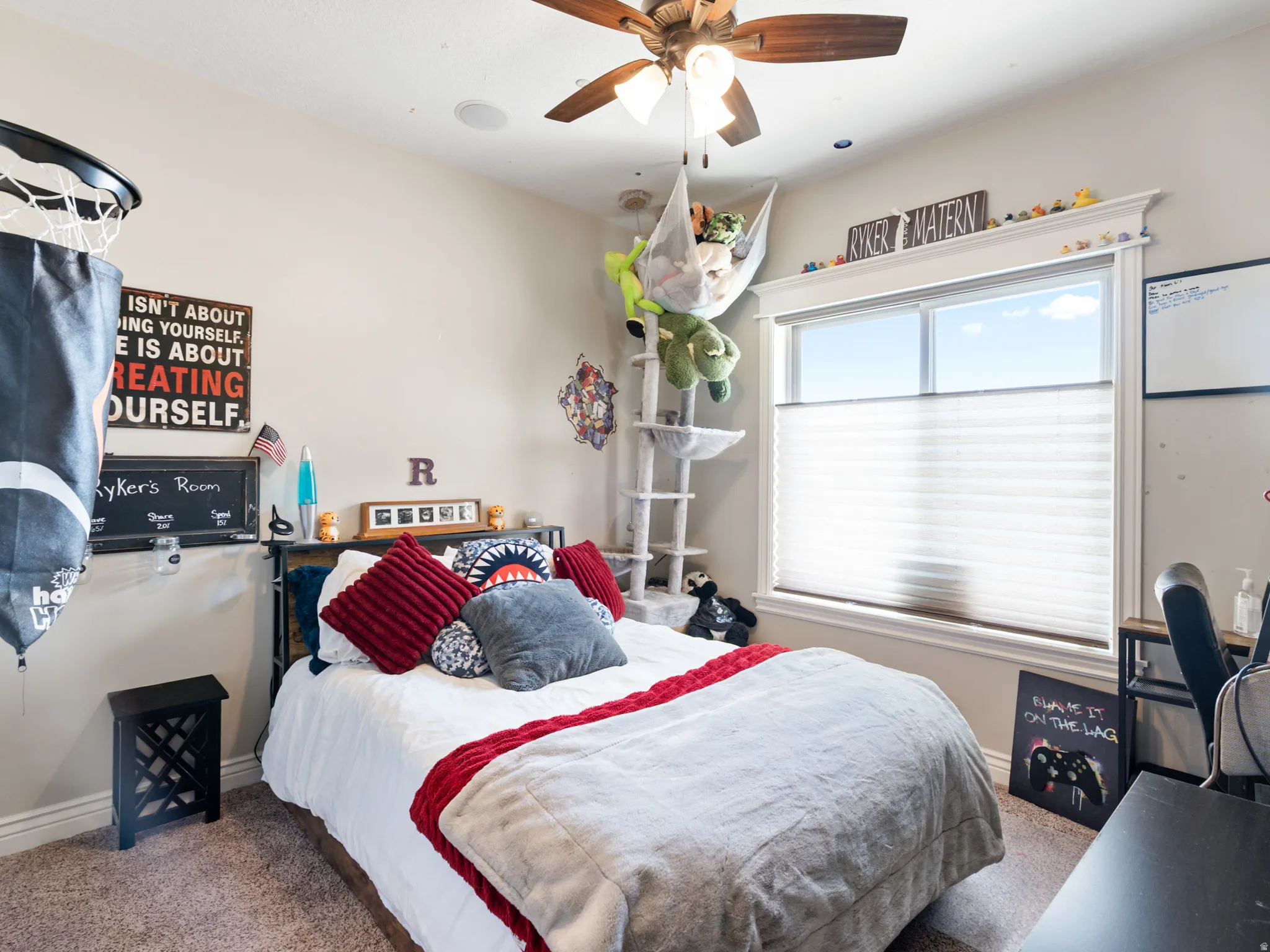 Bedroom with carpet and a ceiling fan