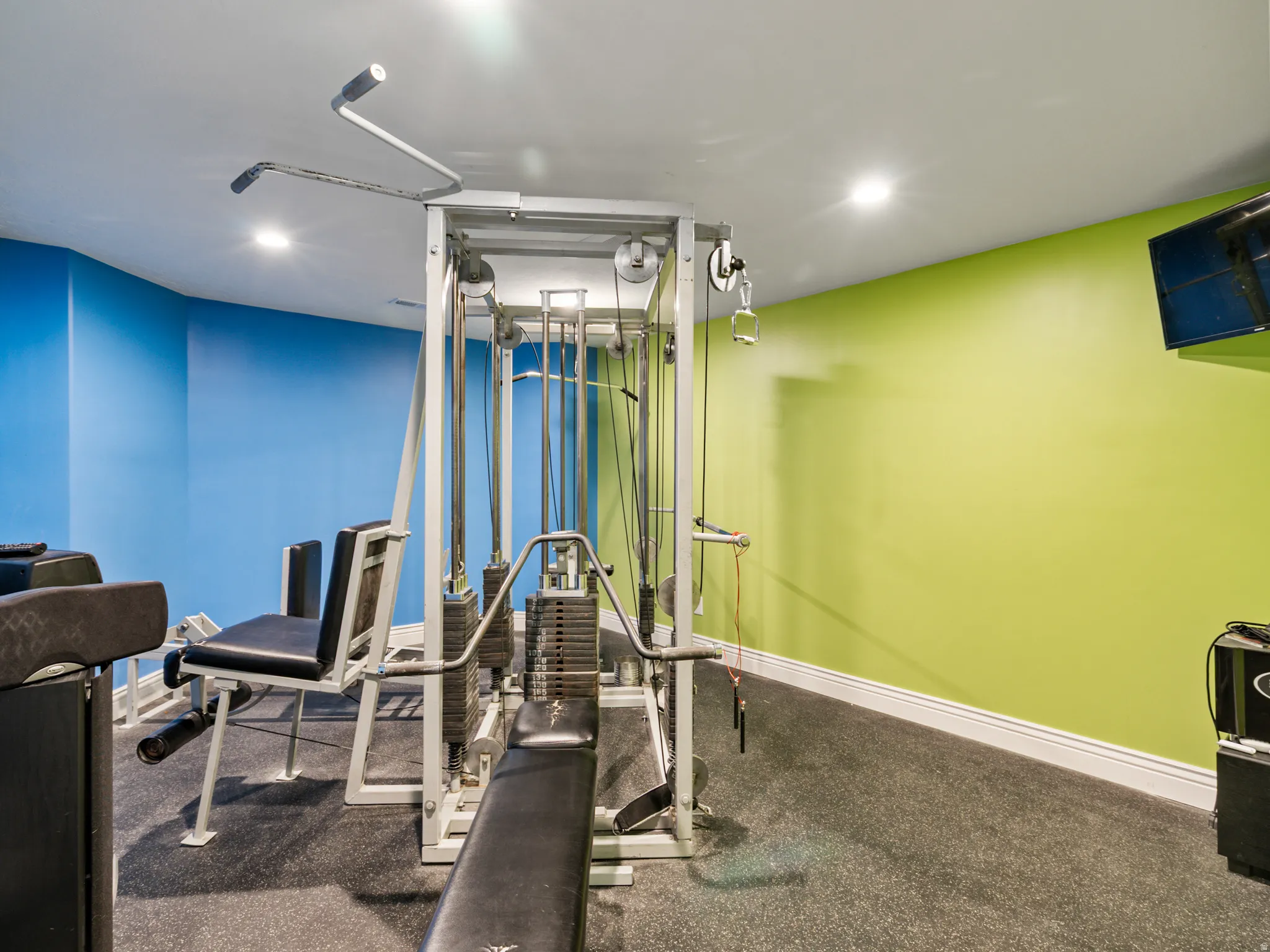 Workout area featuring recessed lighting