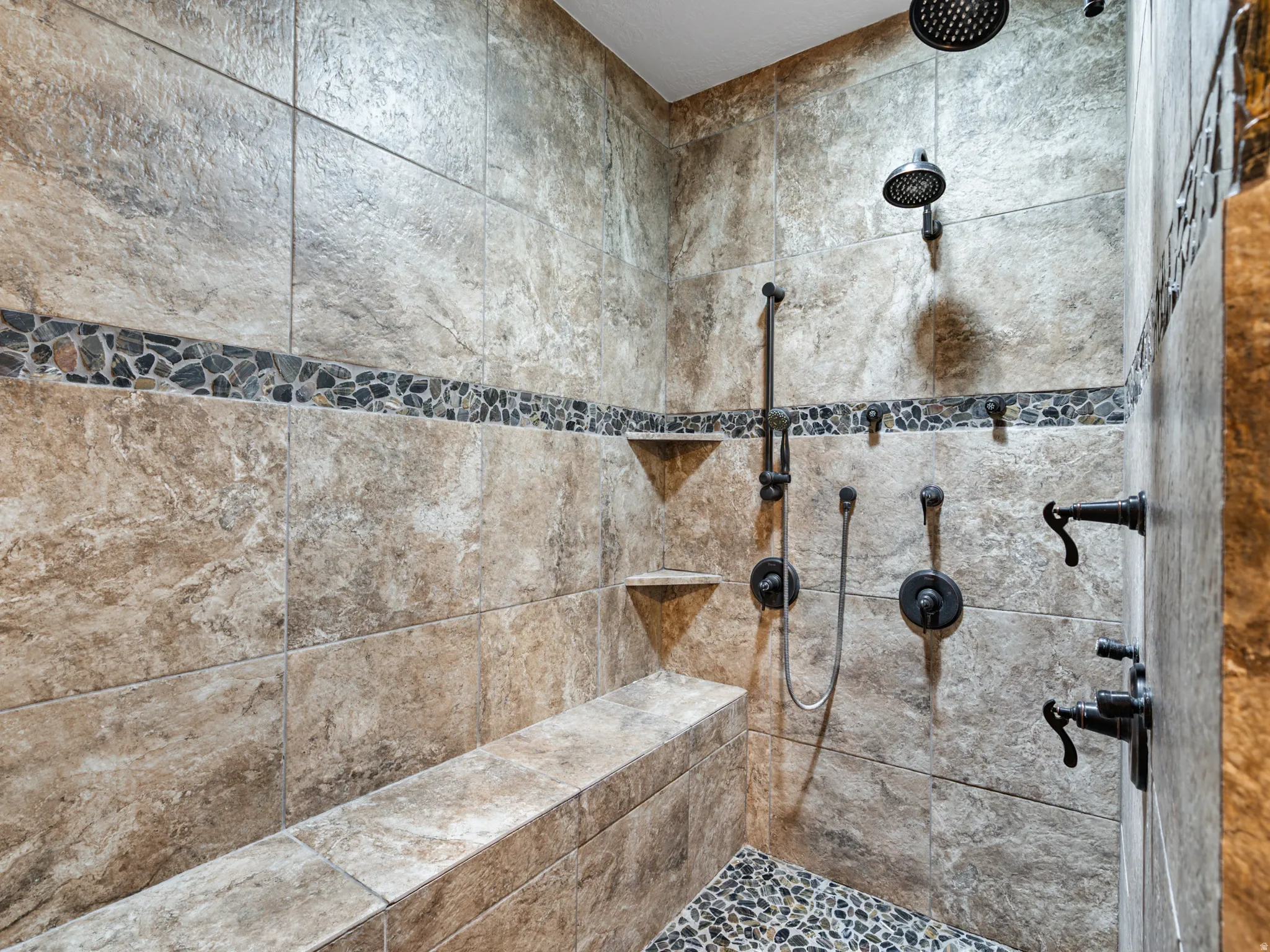 Bathroom featuring a tile shower