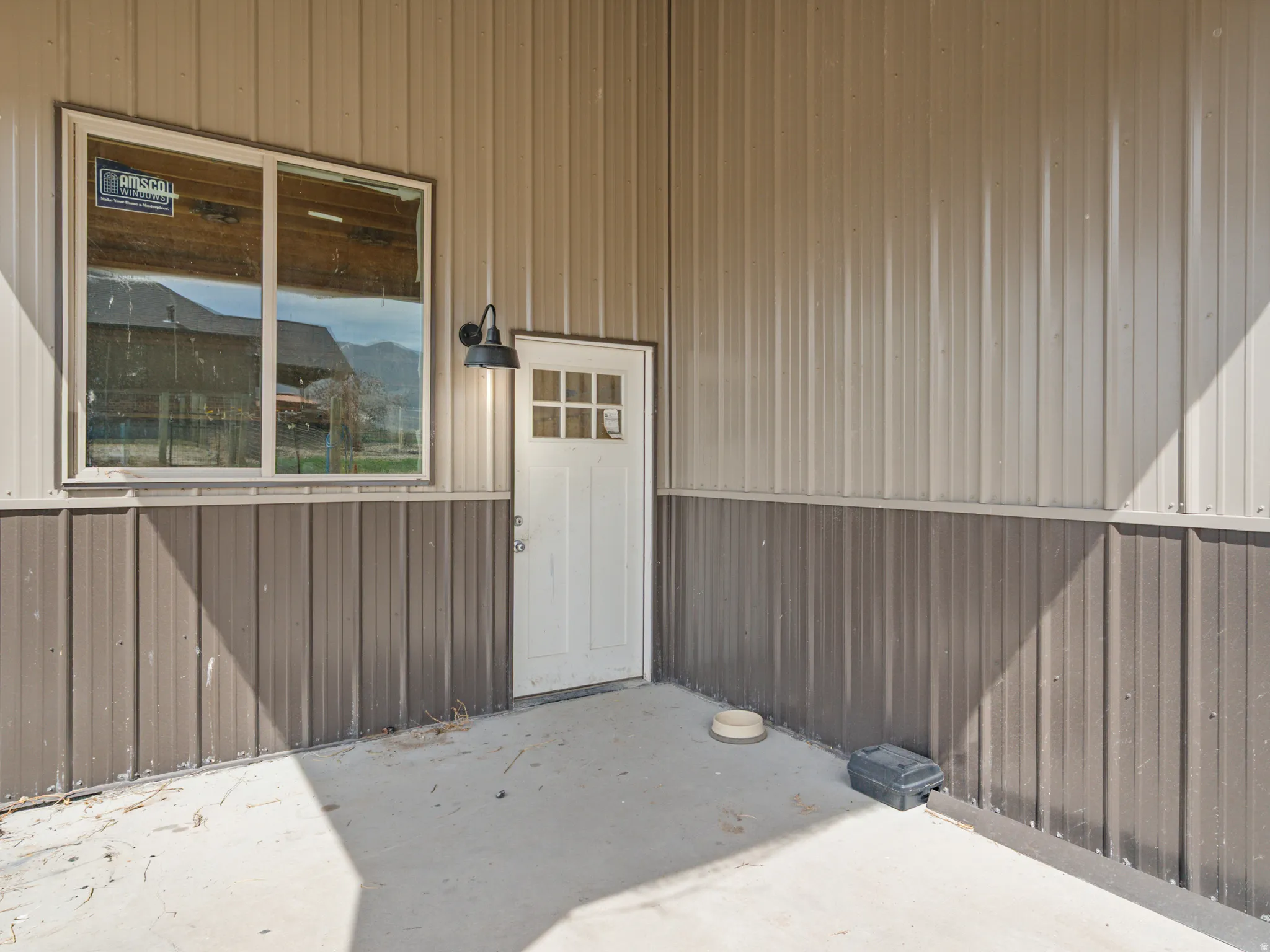 Doorway to property featuring a patio