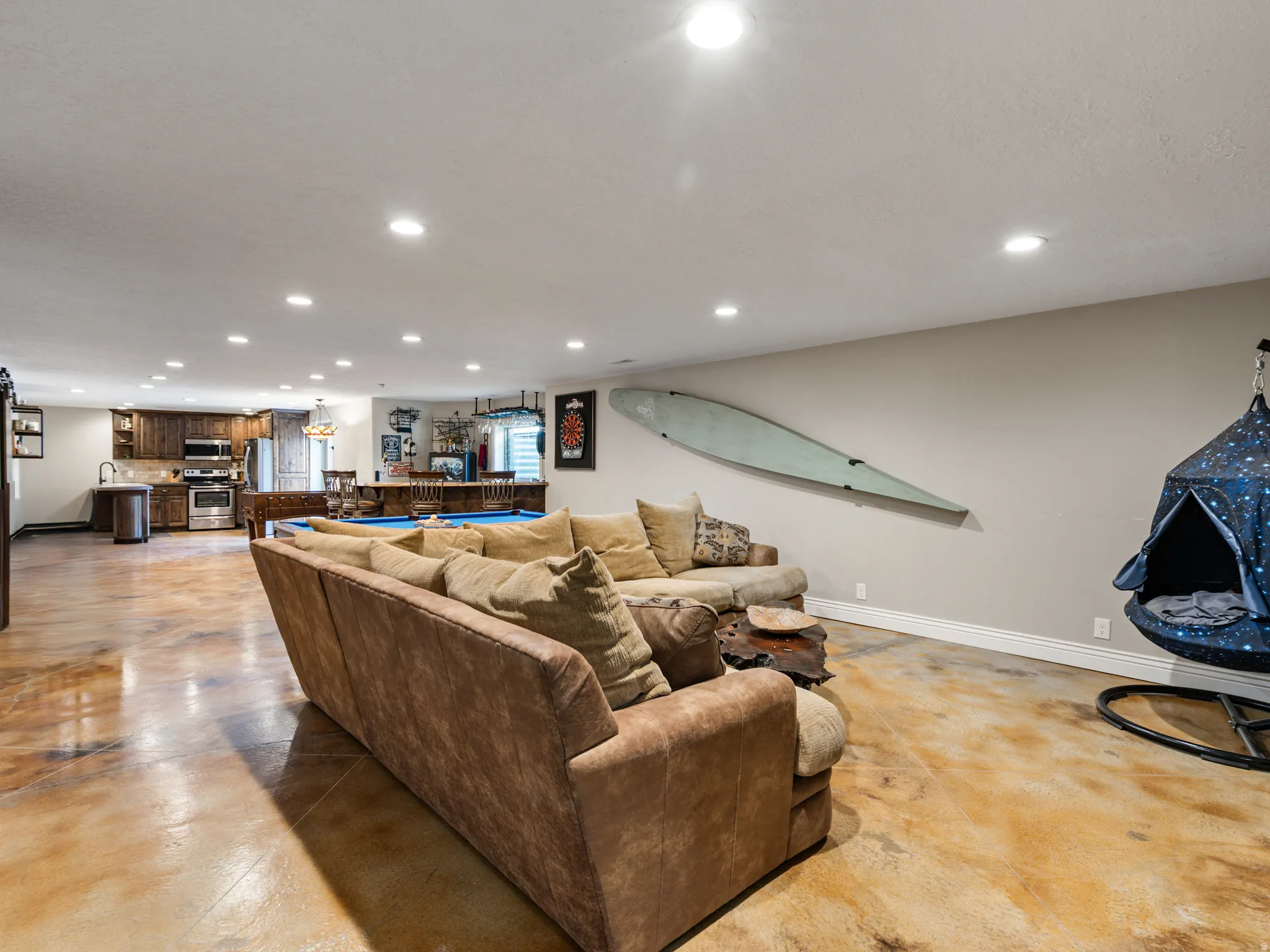 Living area featuring concrete flooring and recessed lighting