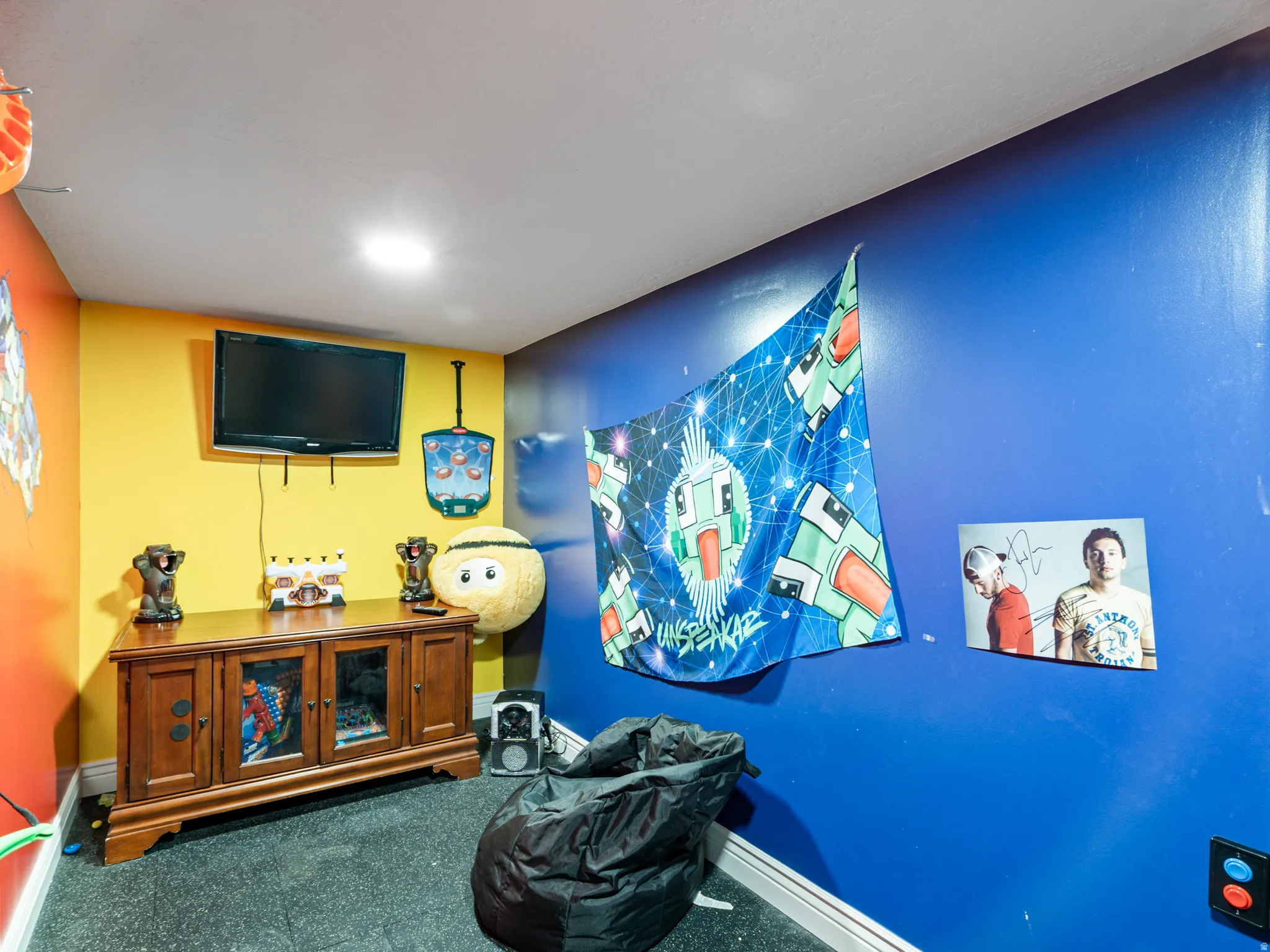Home theater with dark carpet and baseboards