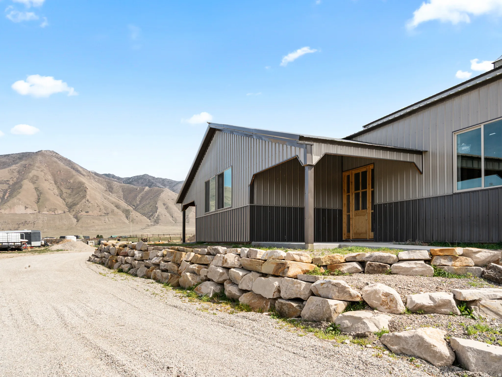 View of side of property with a mountain view