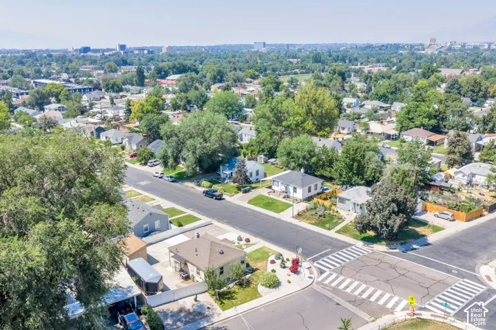 Aerial perspective showcasing a residential neighborhood with mature trees
