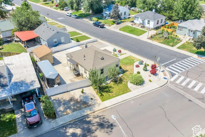 Corner lot property featuring a single-story residence with a gabled roof