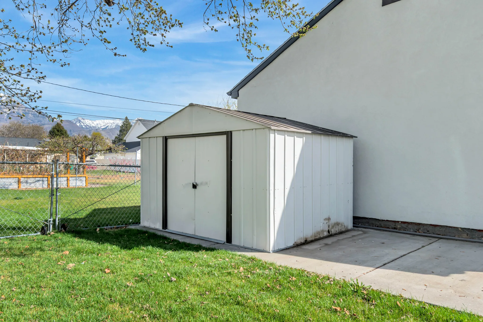 View of shed with a gate and a mountain view