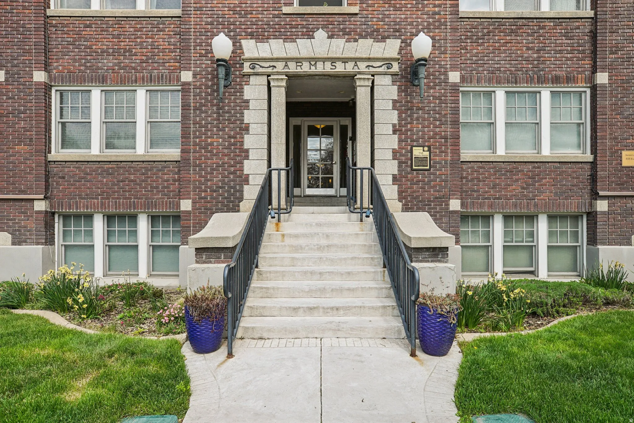 Property entrance featuring brick siding