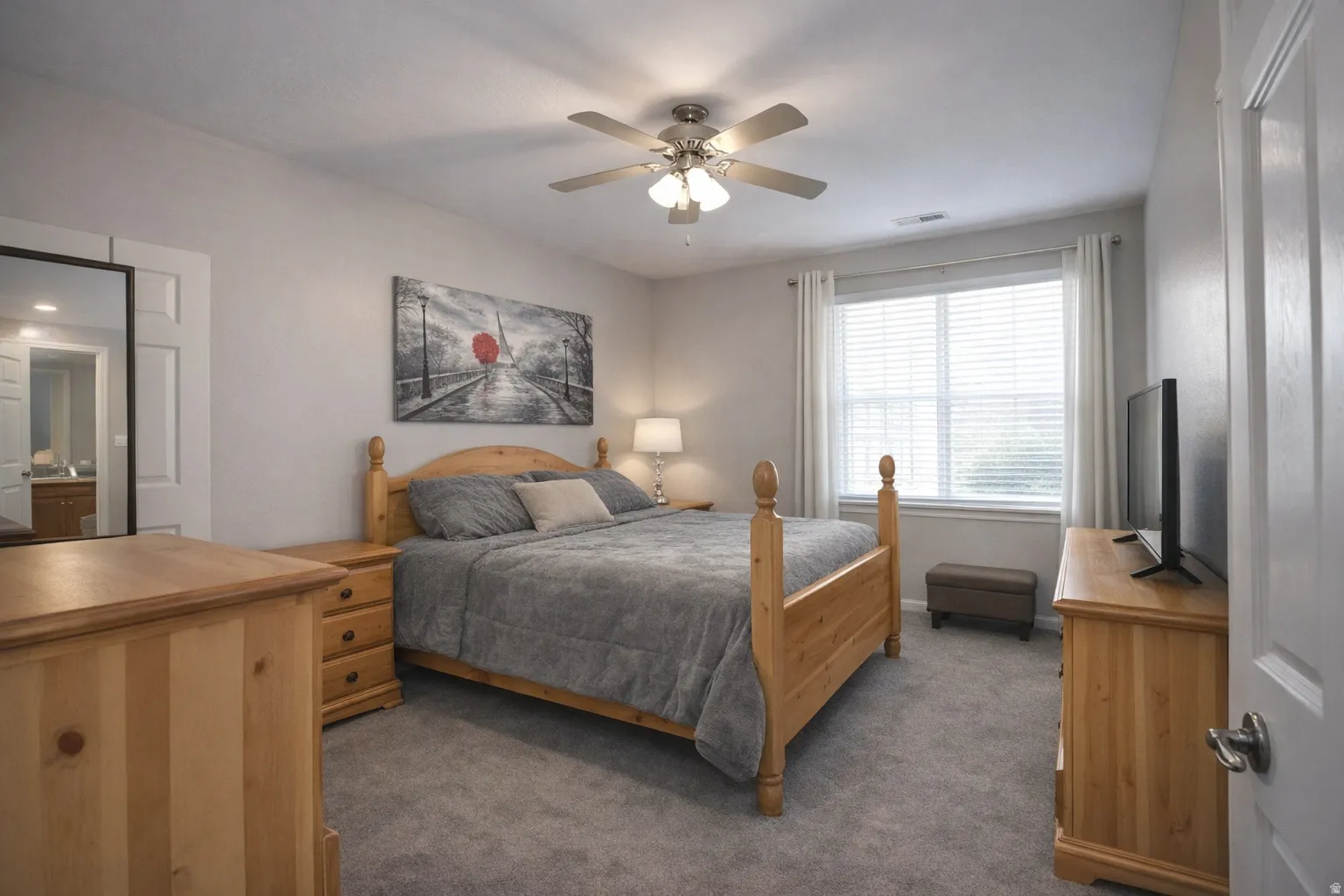 Bedroom featuring dark carpet and ceiling fan