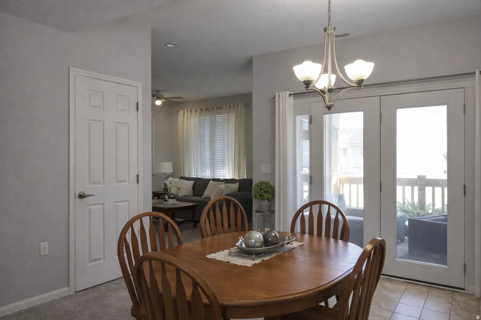 Dining area featuring a ceiling fan and hanging lights