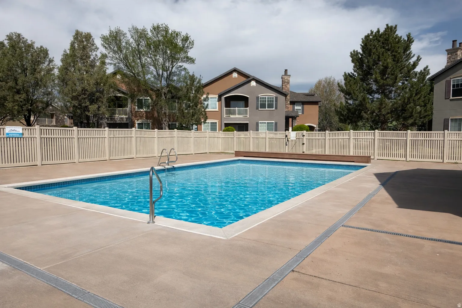 Community pool featuring a patio area