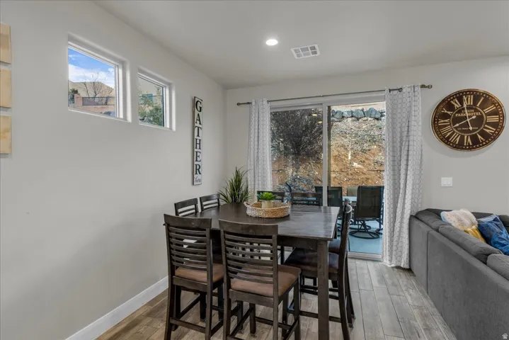 Dining space featuring light wood-type flooring and recessed lighting