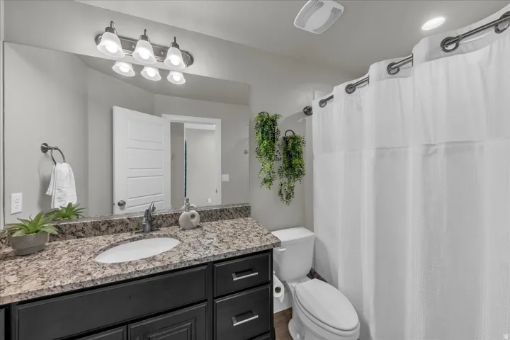 Bathroom with vanity and a shower with curtain